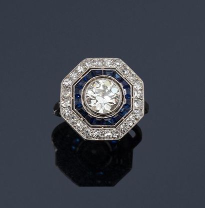 null Art Deco ring with an octagonal platinum bezel centered on an antique cut diamond...
