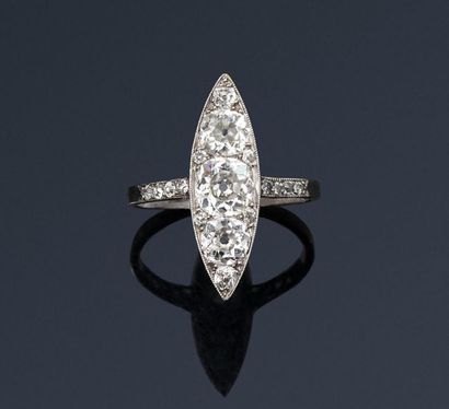null Marquise" ring in platinum, the bezel adorned with an 8/8 and antique cut diamonds,...