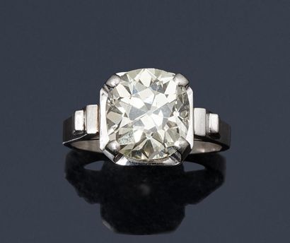 null Platinum solitaire ring set with an antique cut cushion diamond.
French dog's...
