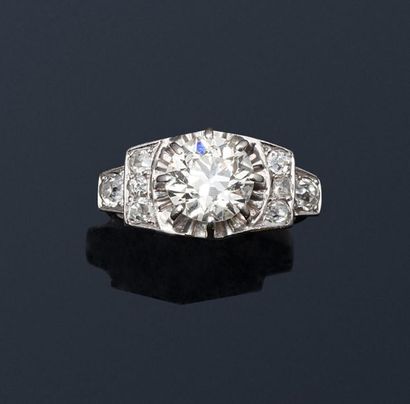 null Platinum solitaire ring set with an old cut diamond shouldered with small 8/8...