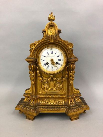 null Gilded bronze mantel surround, the circular dial inscribed with an architectural...