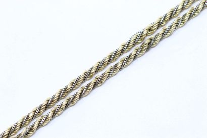 null Bracelet en or jaune et gris 18k (750) cordé formé de deux torsades imbriquées...