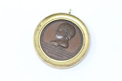 null Bronze medal set in a brass frame to form a pendant.

Obverse: bust to the left...