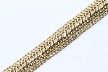 null Bracelet en or jaune 18K (750) à maille tressée.

Tour de poignet : 17.5 cm....