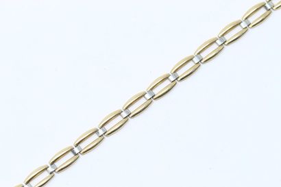 null Bracelet en or jaune et gris18K (750) agrémenté d'une breloque AUGIS "Moins...