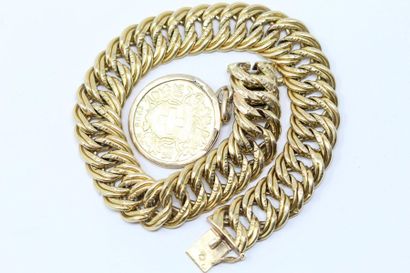 null Bracelet en or jaune 18k (750) à maille américaine orné d'un pièce de 20 francs...