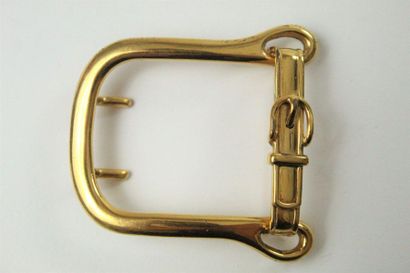 HERMES HERMES

Gold metal belt buckle stylizing a small belt buckle.