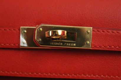HERMES HERMES 

Sac modèle "Kelly pochette" en swift rouge capucine et garniture...