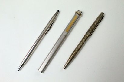Three ballpoint pens:

- Brushed steel CARTIER,...