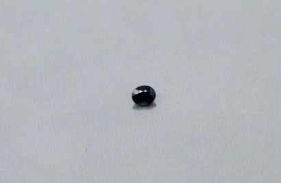 null Oval sapphire on paper. 

Weight: 0.84 ct. 