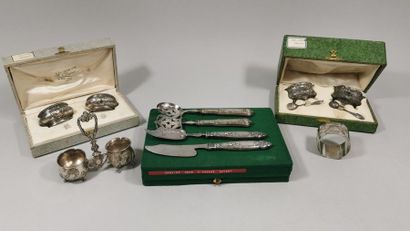 null Lot of silverware comprising : 

- Two pairs of salt shakers, one with two salt...