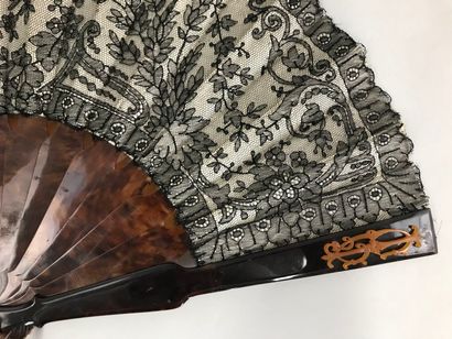null Garlands, circa 1890-1900

Folded fan, the black lace leaf, with bobbins, with...