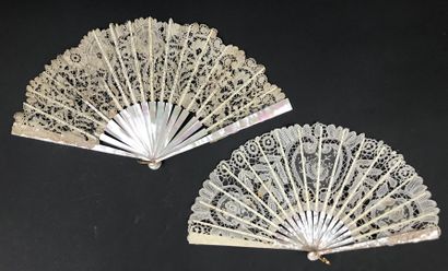 null Two fans, early 20th century

White lace leaves with spindle-shaped flower decoration,...