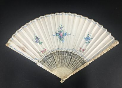  The fruit merchant, 18th century 
Folded fan, the skin sheet lined with paper, and...