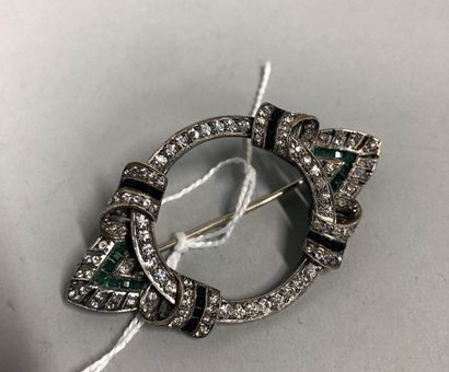 null Silver brooch set with fancy stones. 

Circa 1920. 

Gross weight : 17.08 g....