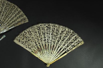 null Two fans, late 19th century

*One, the lace leaf. Ivory frame* (18th century)....