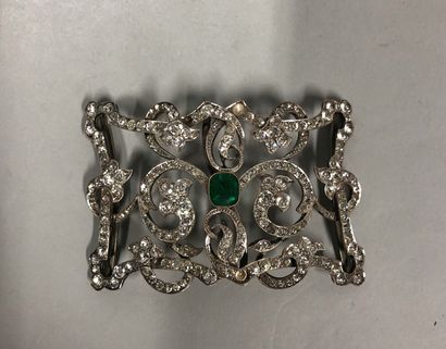 null Silver belt buckle set with fancy stones. 

Reverse side is gilded. 

Circa...