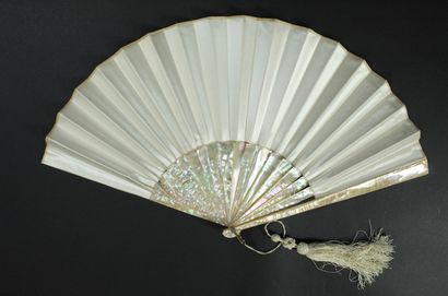 null The toilet, circa 1880-1900

A fan, the cream satin leaf painted in an elegant...