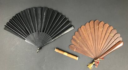 null Three fans, late 19th century

The first one, folded, the black fabric sheet...