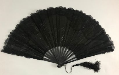 null Sequins, circa 1890

Folded fan, the fabric leaf decorated with black mechanical...