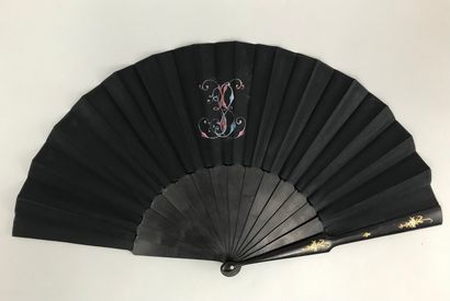 null Two fans, late 19th century

*One, the black satin leaf painted with a Chinese-inspired...