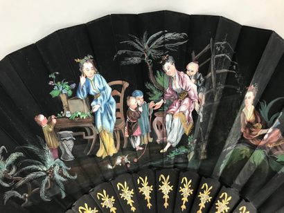 null Two fans, late 19th century

*One, the black satin leaf painted with a Chinese-inspired...