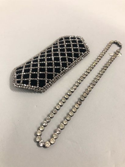 null Belt plate made of steel mesh over a velvet bottom. 

A river necklace made...