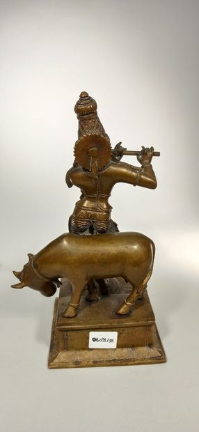 null Bronze goddess with an ormolu patina representing a goddess with flute and buffalo.

Height:...