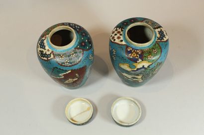 null Pair of ovoid stoneware covered pots with enamel decoration in imitation of...