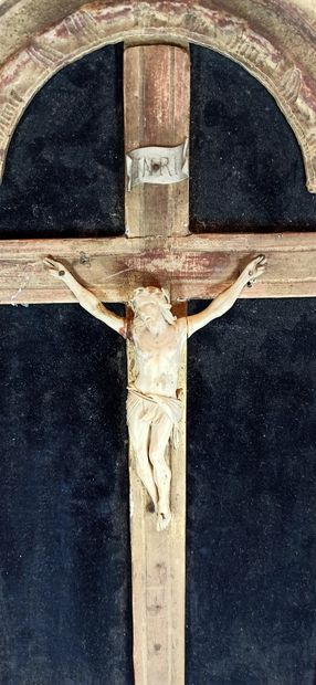 null An ivory cross Christ in a gilded wood and stucco frame with stylized flower...