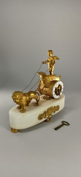 null Gilded bronze clock known as the chariot of love, enamelled ring dial inscribed...