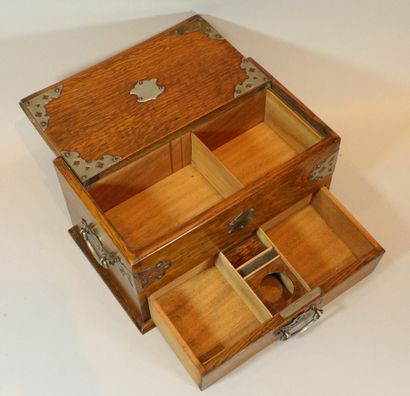 null Wooden box, a drawer in belt with two compartments, its opening uncovers the...