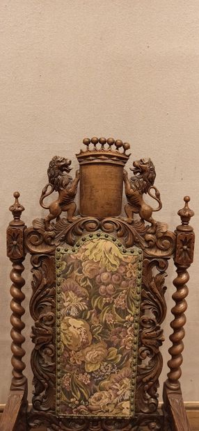 null Carved wooden armchair with a high flat openwork back, decorated with twisted...