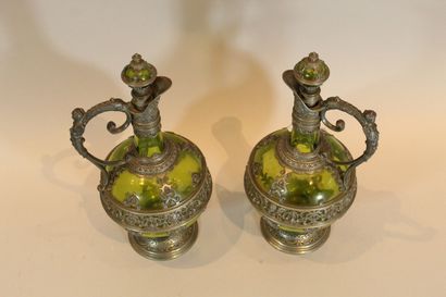 null Pair of Renaissance style decanters in green glass, rich pewter alloy frame.

Ht.:...
