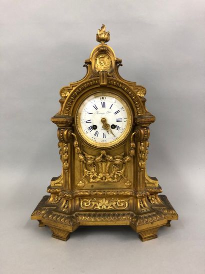 null Gilded bronze mantel surround, the circular dial inscribed with an architectural...