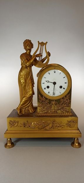 null Bronze clock allegory of music, white enamelled dial signed Bafsot, restoration...