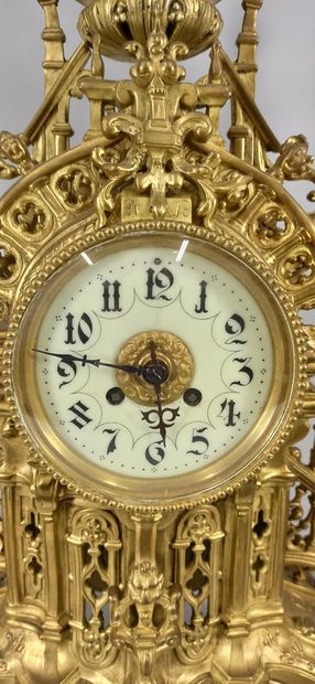 null Important chased bronze neo-Gothic mantel set consisting of a clock, cream enameled...