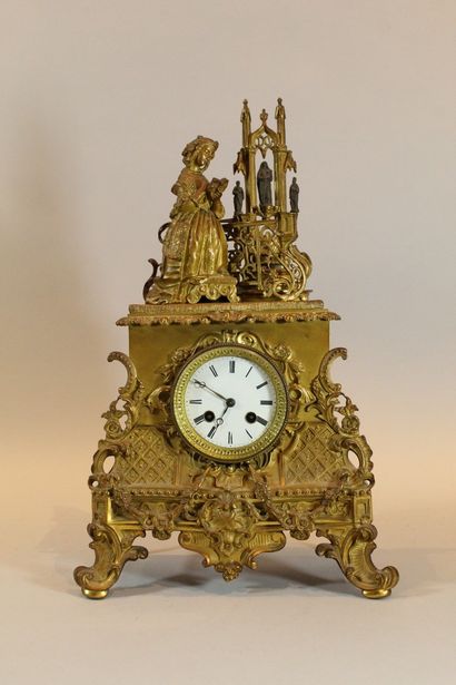 null Romantic gilt bronze clock with a young woman praying in front of an altar....