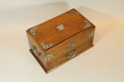 null Wooden box, a drawer in belt with two compartments, its opening uncovers the...
