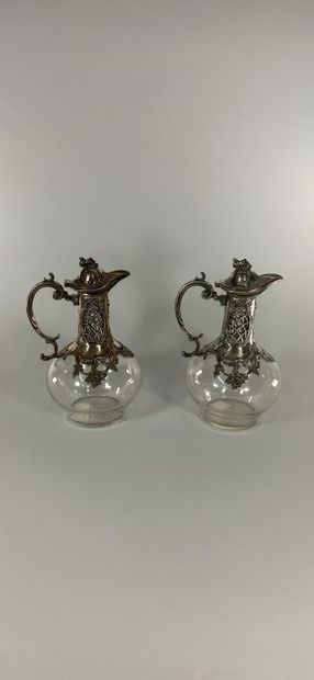 null Two ewers mounted in silvery metal with a bunch of grapes decoration.



Ht.:...