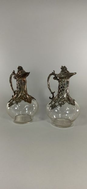 Two ewers mounted in silvery metal with a...