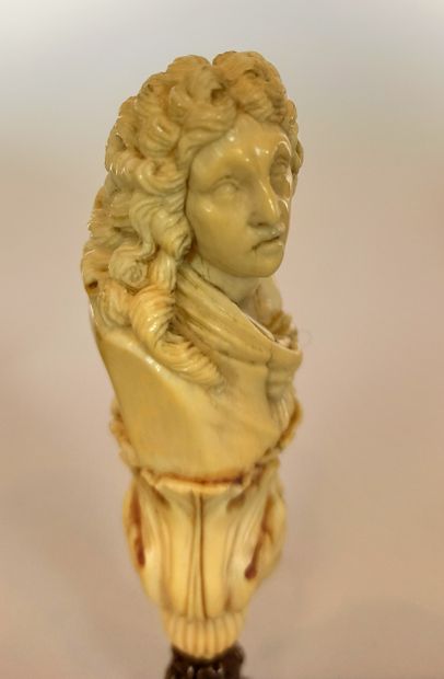 null Seal with an ivory handle formed by a bust of a man sheathed in foliage, matrix...