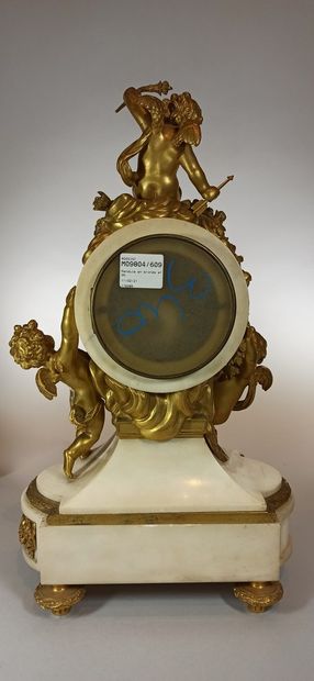 null White marble and gilt bronze clock, circular dial supported by two puttis and...