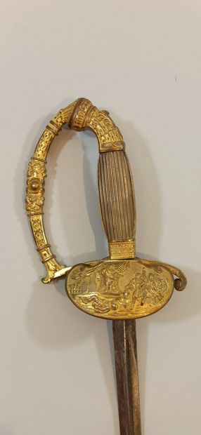 null Epée d'uniforme.

Monture en bronze décoré et à une branche. Clavier orné d'une...