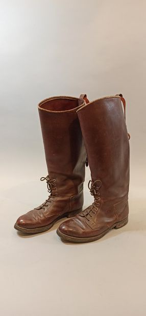  Three pairs of boots with lacing on the instep. 2 in brown leather and 1 in black...