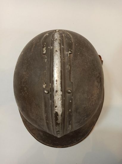 null Two Adrian Model 26 helmets. One complete with Infantry insignia, chinstrap...