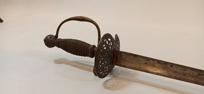 null City sword. 

Iron hilt with a guard branch and an openwork bivalve shell decorated...