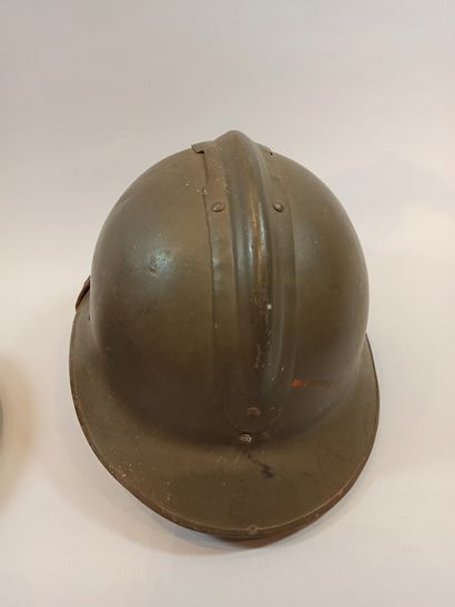 null Two Adrian Model 26 helmets. One complete with Infantry insignia, chinstrap...