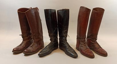  Three pairs of boots with lacing on the instep. 2 in brown leather and 1 in black...