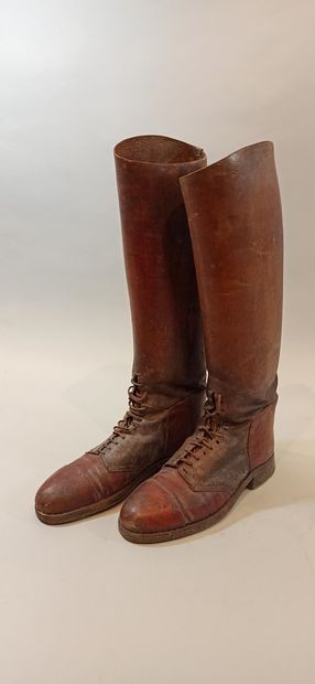 null Three pairs of boots with lacing on the instep. 2 in brown leather and 1 in...